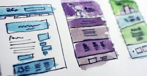 pen and paper wireframes, coloured in