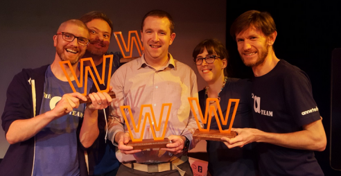 Annertech staff holding multiple awards, including Web Agency of the Year