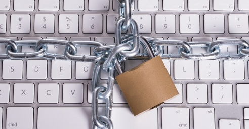 Keyboard chained with padlock.