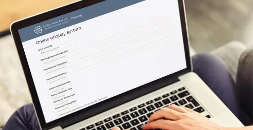 A woman fills out a form on Ireland's ePlanning portal.