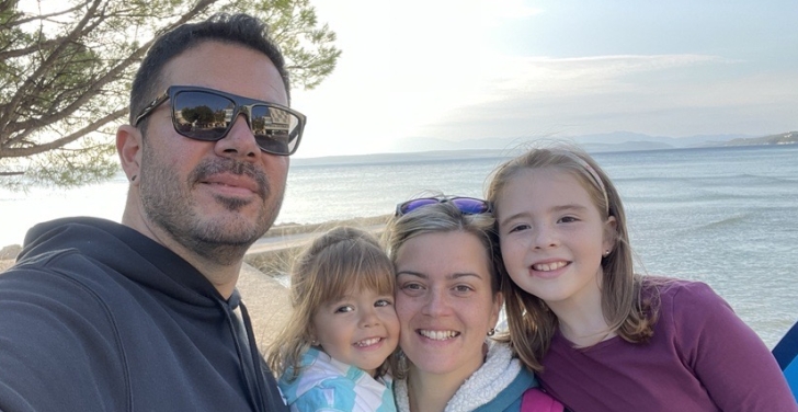 Juanluis Lozano on the beach with his wife and two daughters.