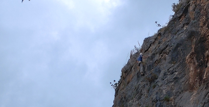 Bill Seremetis climbs a mountain near his house.