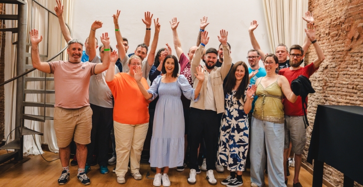 Team Annertech raise their hands in celebration at Born to Cook in Barcelona.