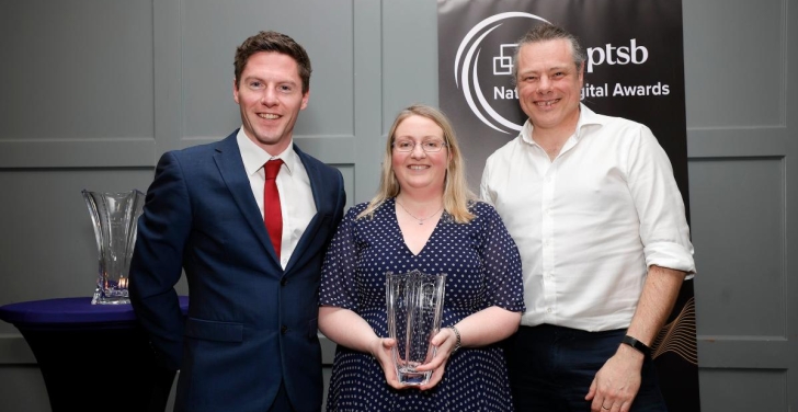 Stella Power and Anthony Lindsay hold a glass trophy at the National Digital Awards 2024