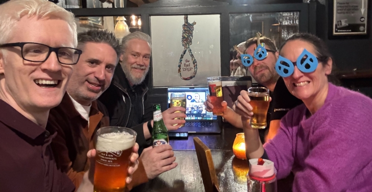 The Edinburgh Drupal CMS launch party took place in a pub. 5 contributors raise their glasses and toast to a successful launch.