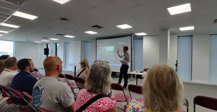 People listen to a presentation about how Cheltenham Borough Council is making significant moves by creating a National Cyber Innovation Centre.