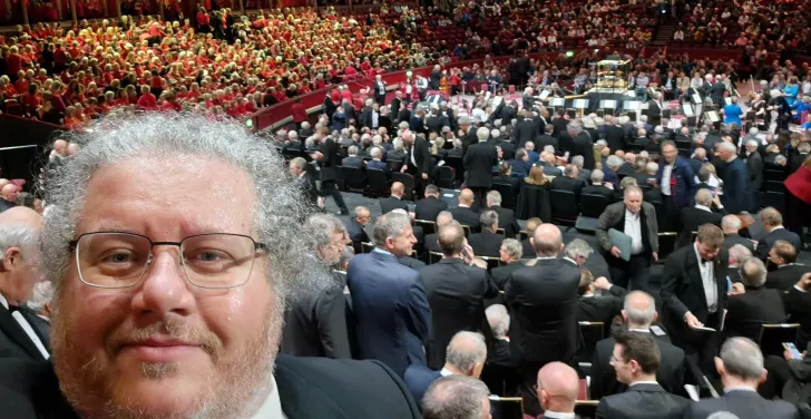 Dermot with a packed Royal Albert Hall in the background