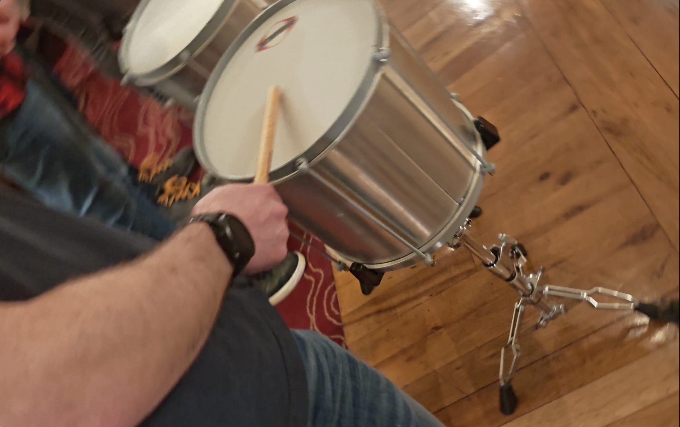 An Annertechie tries his hand at the drums.