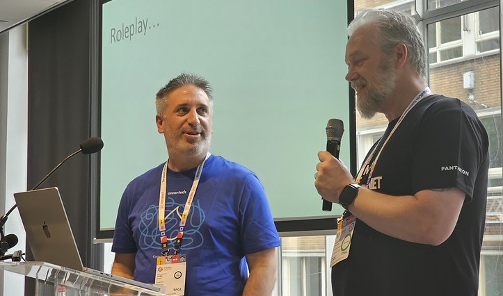 Tony and Gareth role play during their presentation.