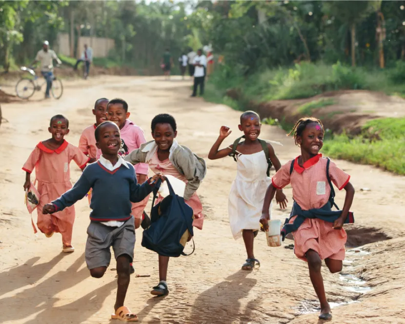 Happy school children running - photo of those Bóthar is helping