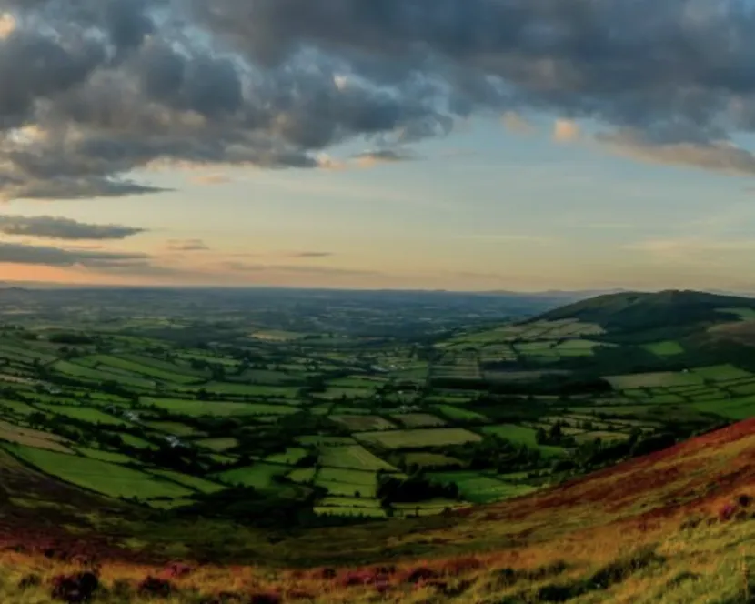 The sun sets over the landscape of County Carlow.