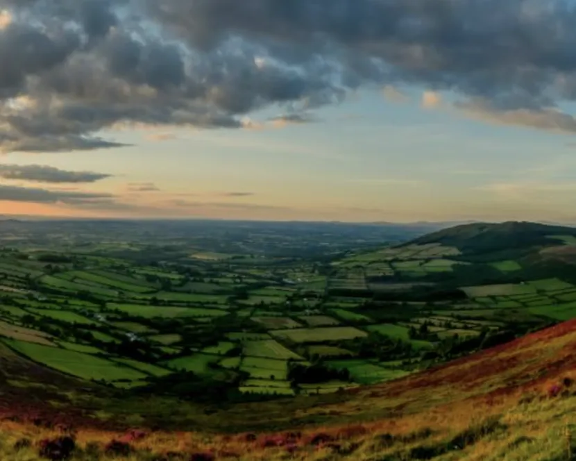 The sun sets over the landscape of County Carlow.