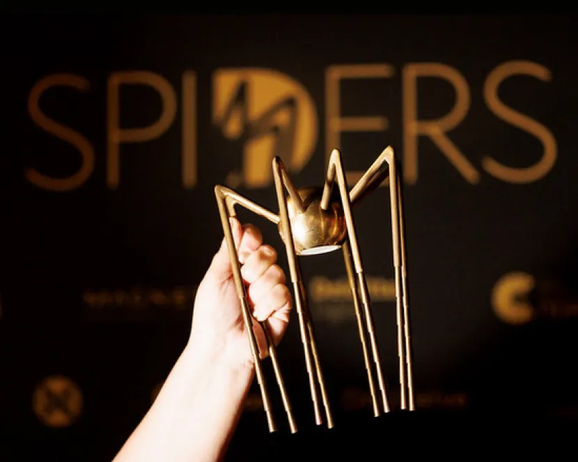 A Spider Awards trophy is held aloft.
