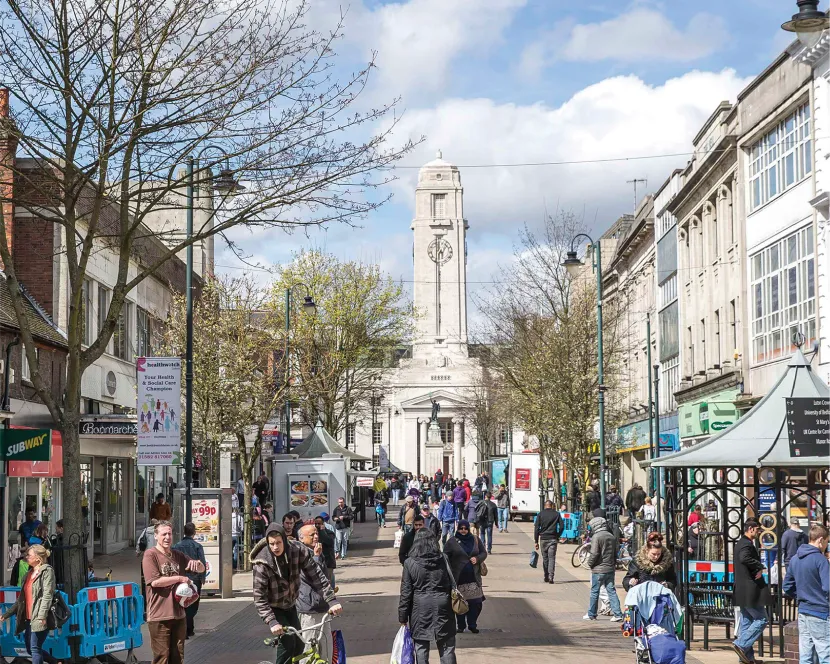 A bustling George Street with Luton Town Hall in the background.