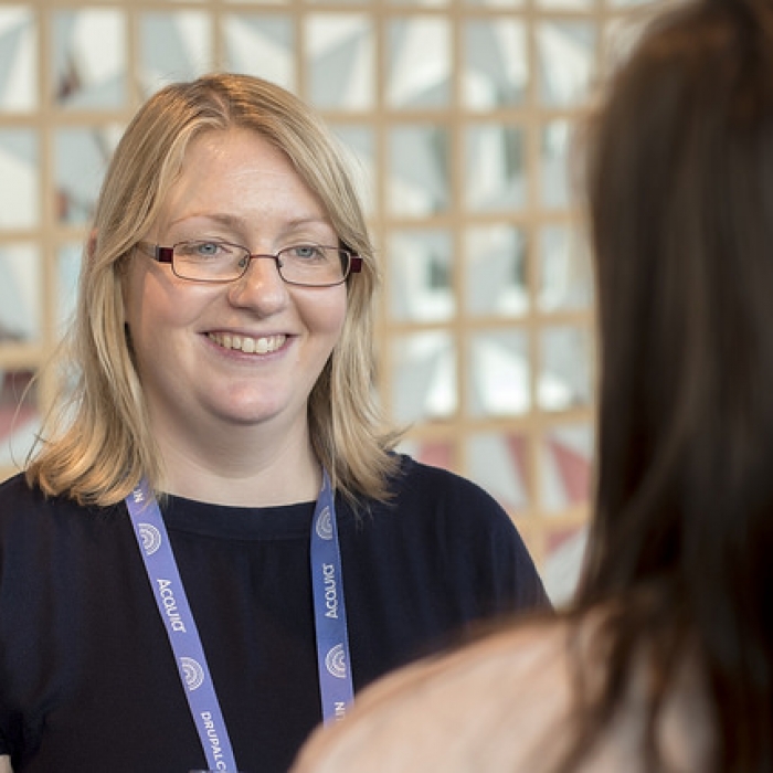 Stella Power talking to someone at DrupalCon Dublin