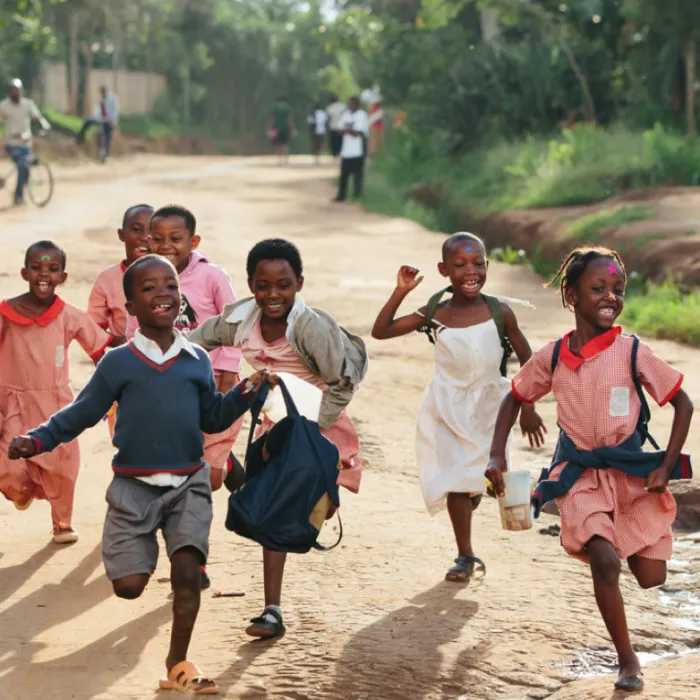 Happy school children running - photo of those Bóthar is helping