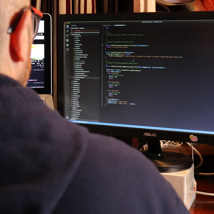 programmer at desk | Annertech development services