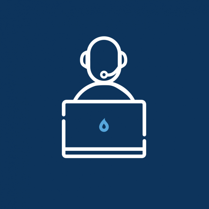 Person at a desk with headset | Support | Annertech services