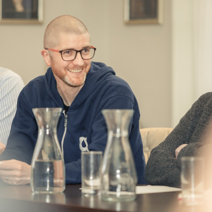 People laughing at a meeting