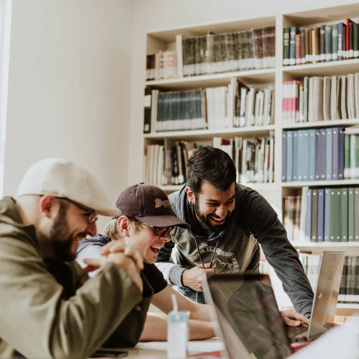 Students work together on a computer.