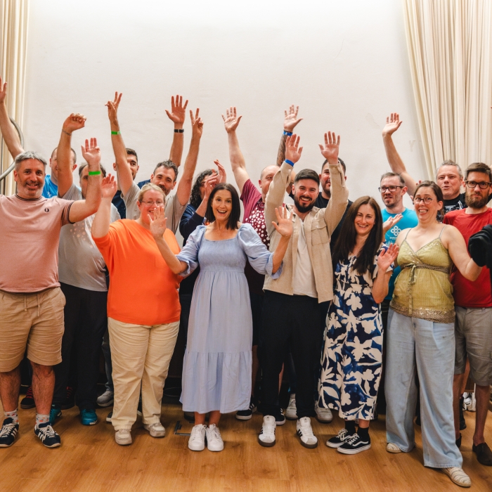 Team Annertech raise their hands in celebration at Born to Cook in Barcelona.