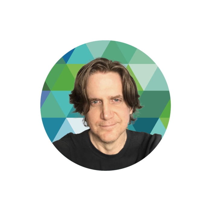 A head and shoulders image of John Albin in front of a kaleidoscope.