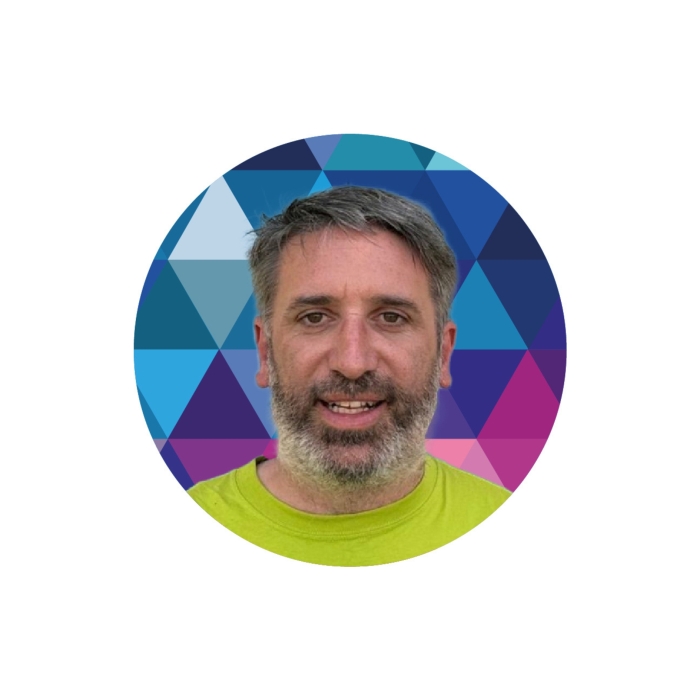 A head and shoulders image of Tony Barker in front of a kaleidoscope.
