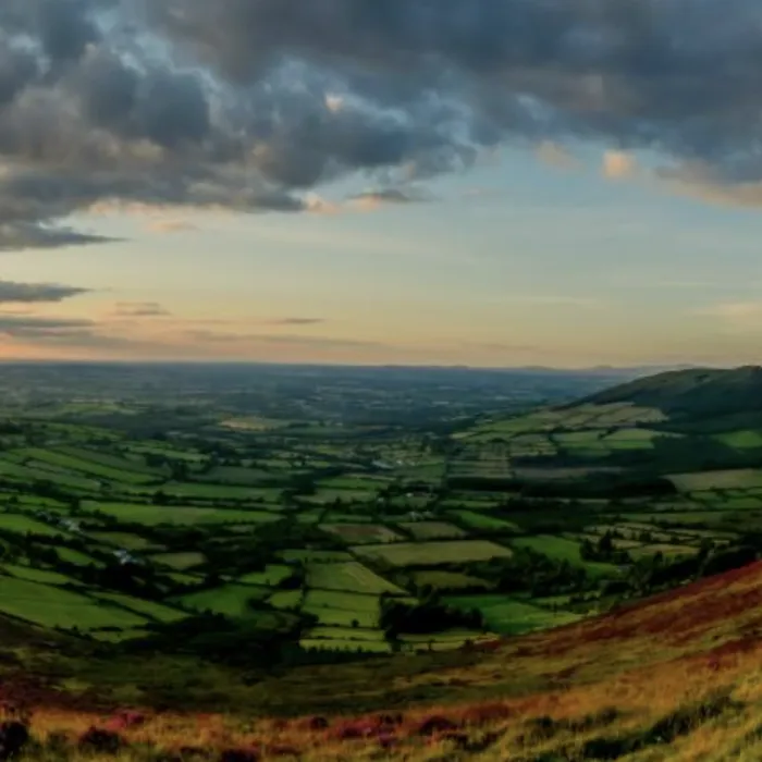 The sun sets over the landscape of County Carlow.