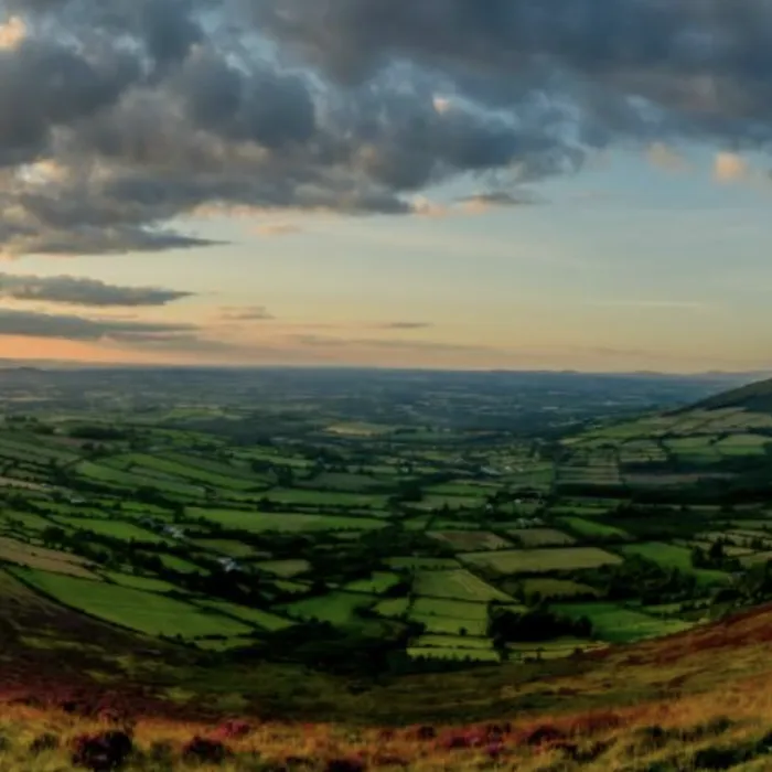 The sun sets over the landscape of County Carlow.