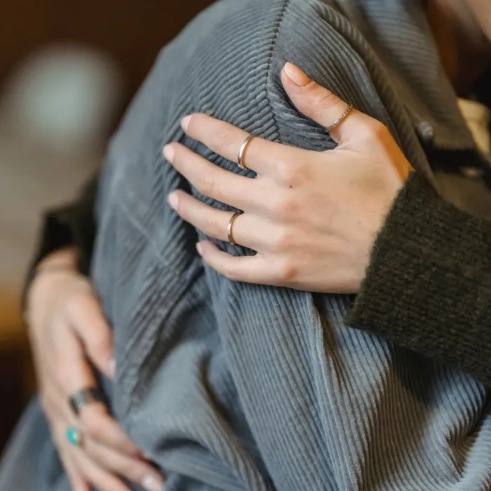 A person is comforted with a hug