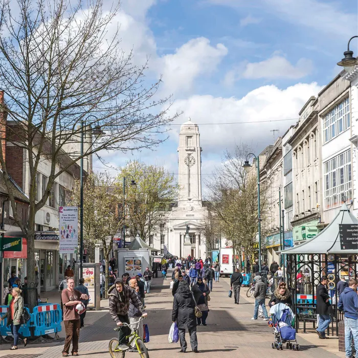 A bustling George Street with Luton Town Hall in the background.
