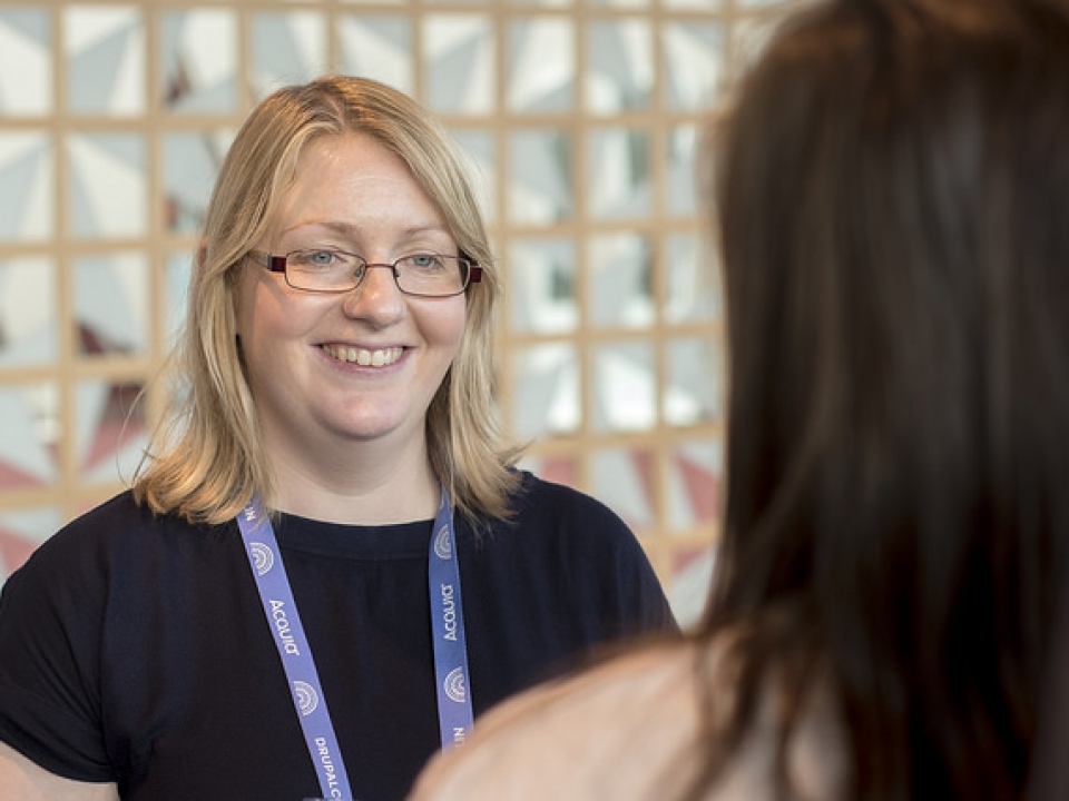 Stella Power talking to someone at DrupalCon Dublin