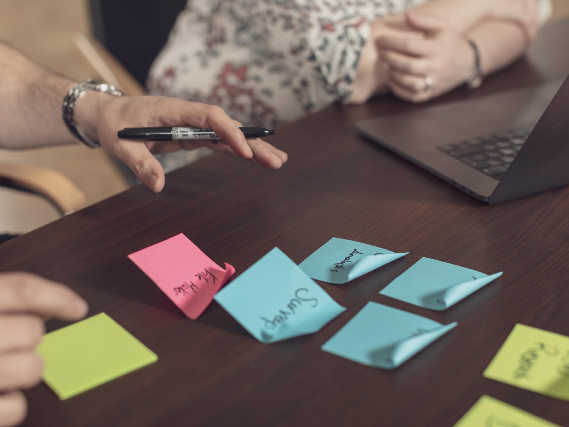 Annertech post-it notes on a desk taken at an Annertech internal retreat