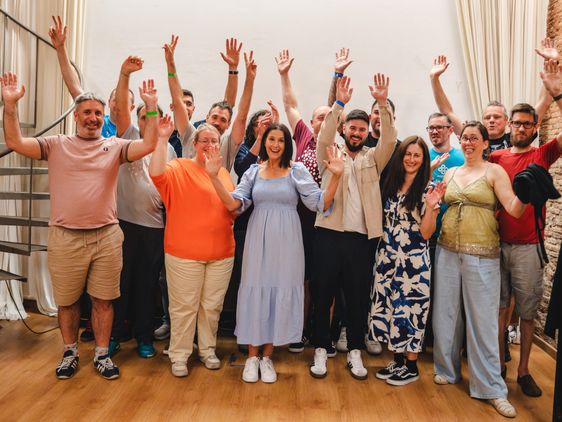 Team Annertech raise their hands in celebration at Born to Cook in Barcelona.