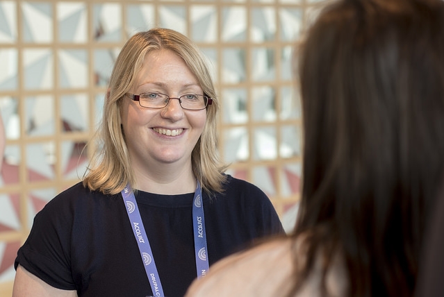 Stella Power talking to someone at DrupalCon Dublin