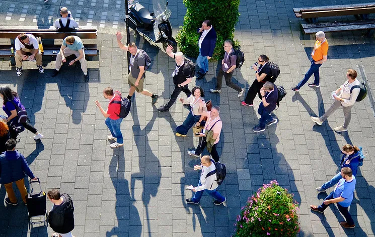 A group of people embark on a walking tour of Rotterdam.